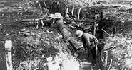 German machine gunners occupy a trench during World War I.